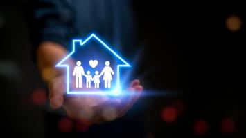 Un pictogramme fluorescent illustrant une famille et une maison