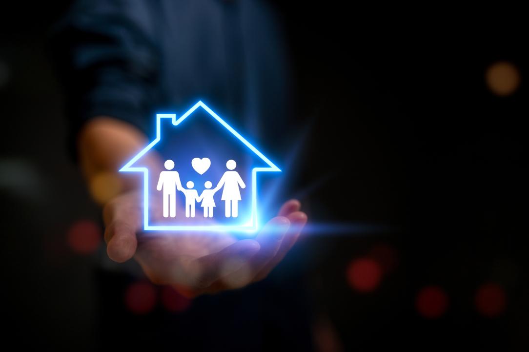 Un pictogramme fluorescent illustrant une famille et une maison